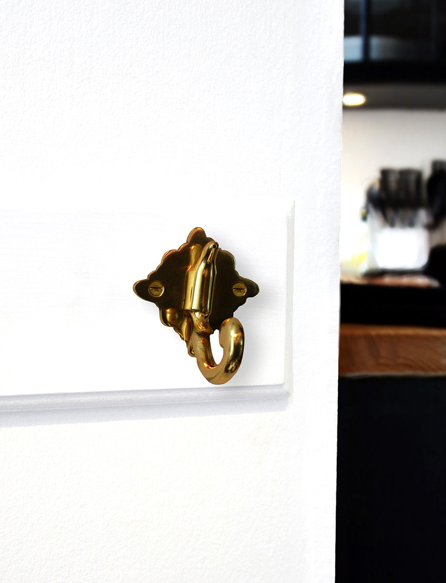 Elegantly shaped hook 1 handle glossy brass with lacquer